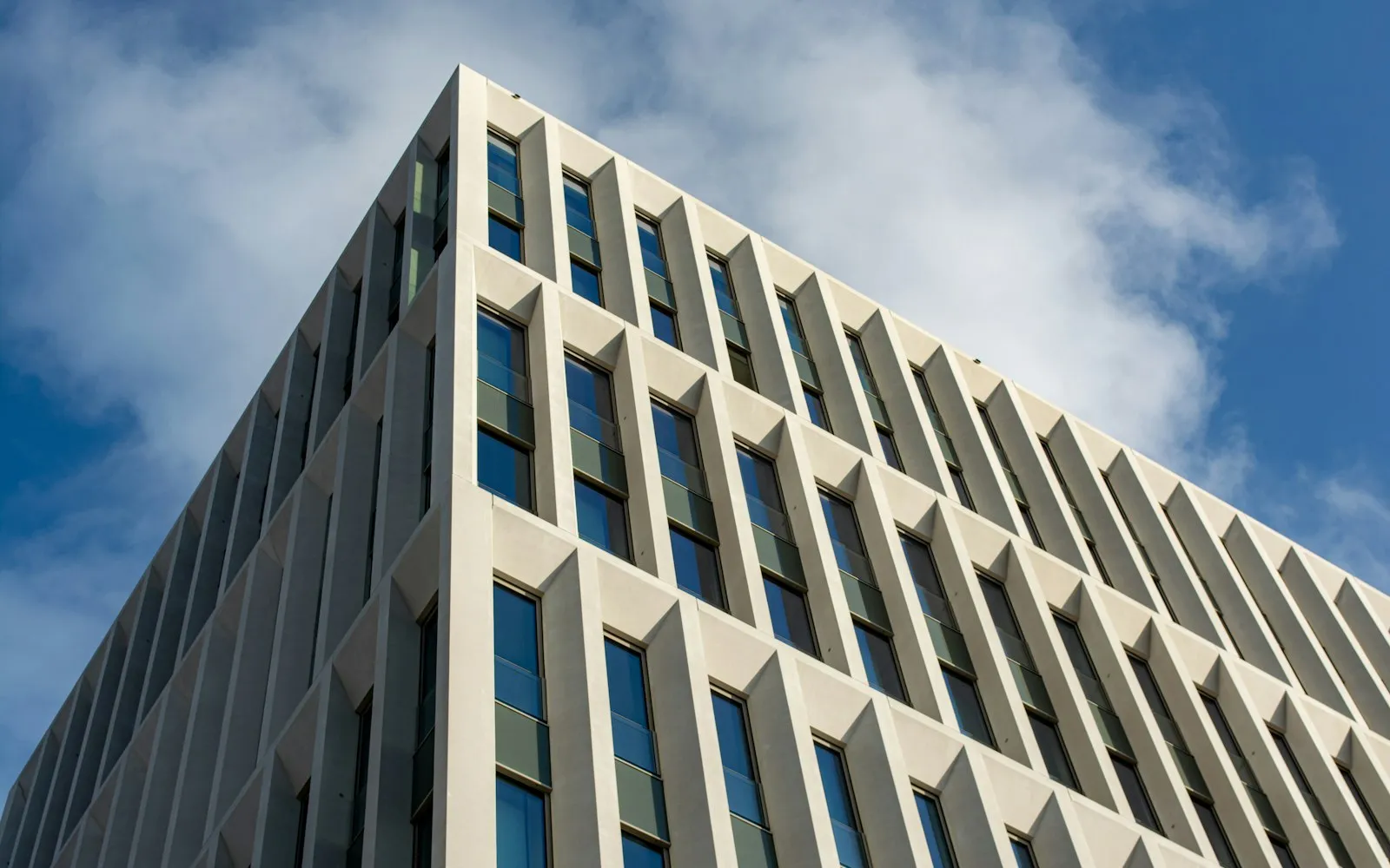 White concrete building under blue sky during daytime